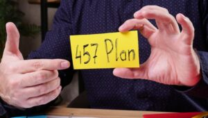 Man holding and pointing to a card that says "$57 Plan".