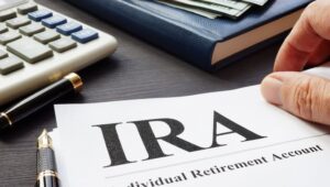 Man reading a document explaining a Traditional IRA.