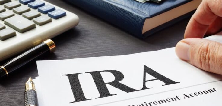 Man reading a document explaining a Traditional IRA.