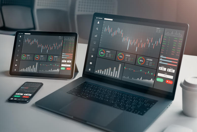 A laptop computer used for financial research and decision making, related to the topic of gold vs bitcoin investments