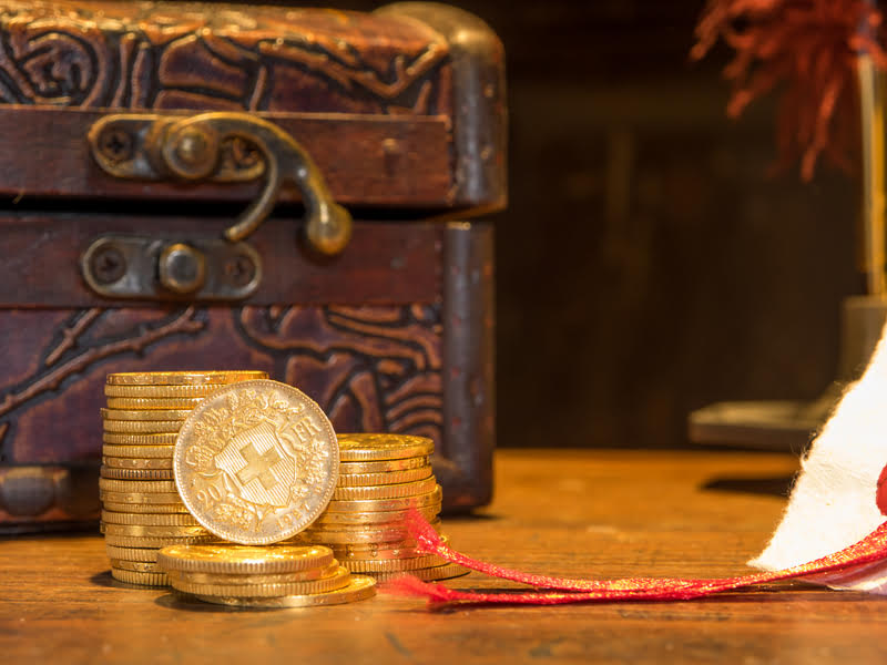 A pile of gold coins, representing the enduring influence of gold throughout history