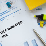 A piece of paper with 'self directed ira' written on it